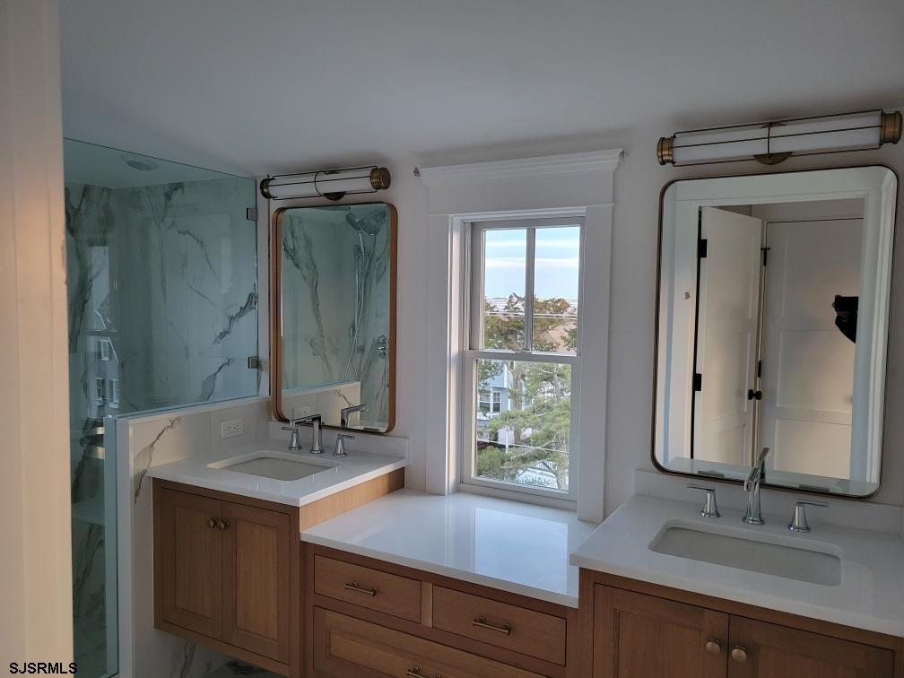 481 7th Street Avalon, NJ 08202 - Photo 41 of 51 a bathroom with a granite countertop sink mirror and double