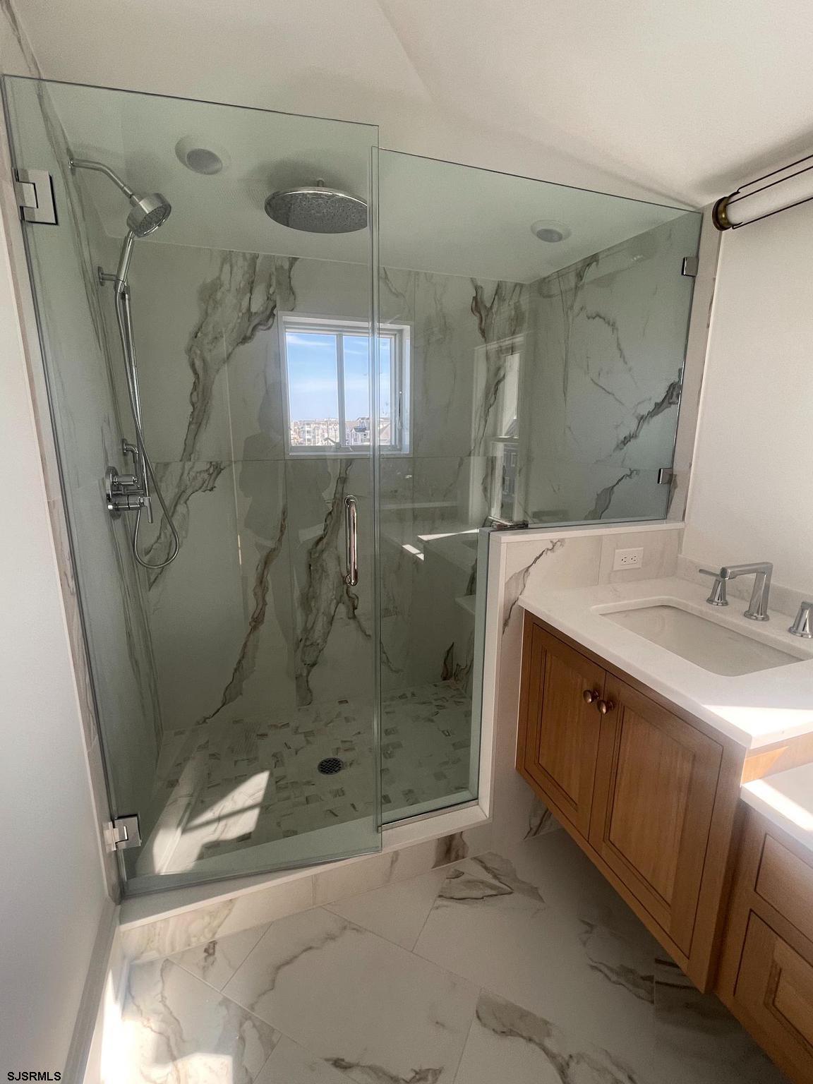 481 7th Street Avalon, NJ 08202 - Photo 42 of 51 a bathroom with a shower and a sink