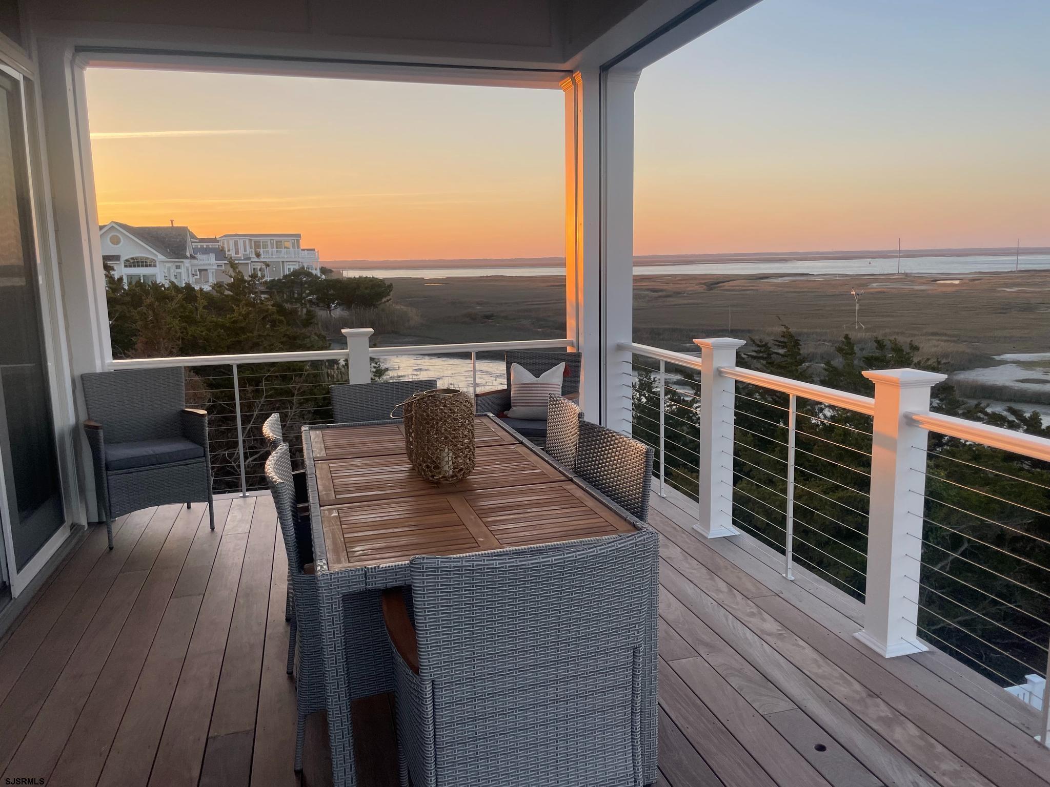 481 7th Street Avalon, NJ 08202 - Photo 6 of 51 a view of a balcony with table and chairs