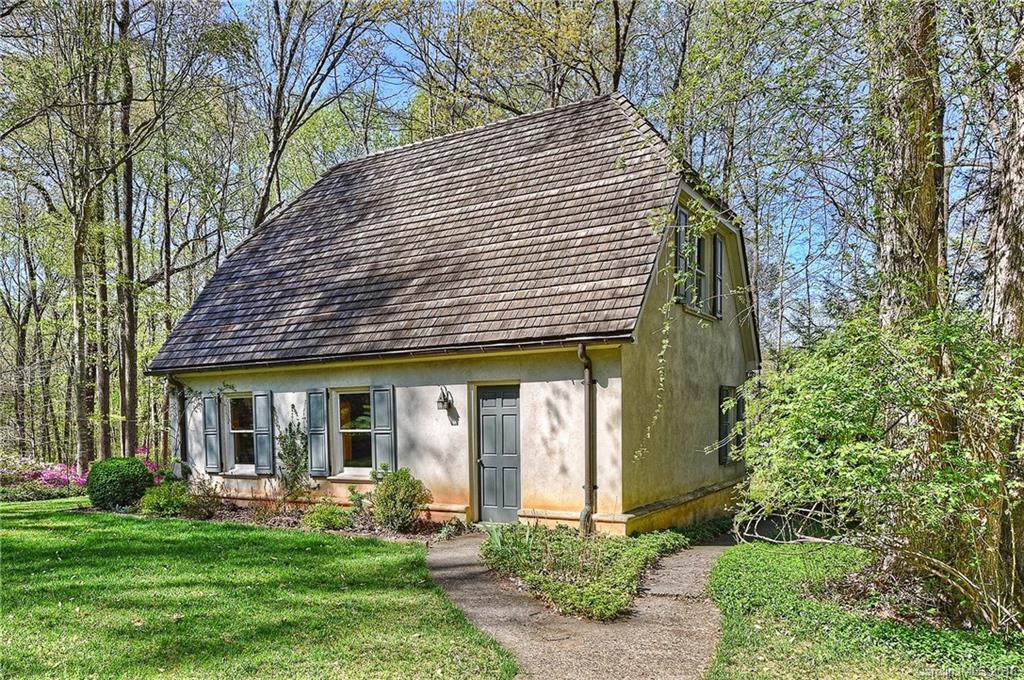 8375 Providence Road Charlotte, NC 28270 - Photo 22 of 24 a front view of a house with a yard table and chairs
