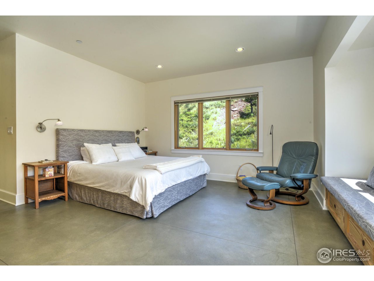 7010 Olde Stage Road Boulder, CO 80302 - Photo 13 of 31 a bedroom with a bed window and chair