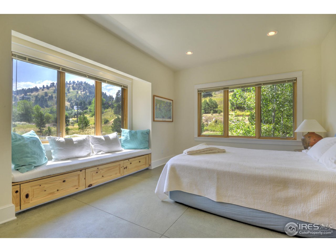 7010 Olde Stage Road Boulder, CO 80302 - Photo 16 of 31 a bedroom with a bed and large window