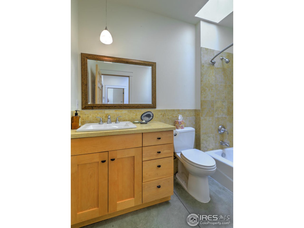 7010 Olde Stage Road Boulder, CO 80302 - Photo 17 of 31 a bathroom with a toilet sink and mirror