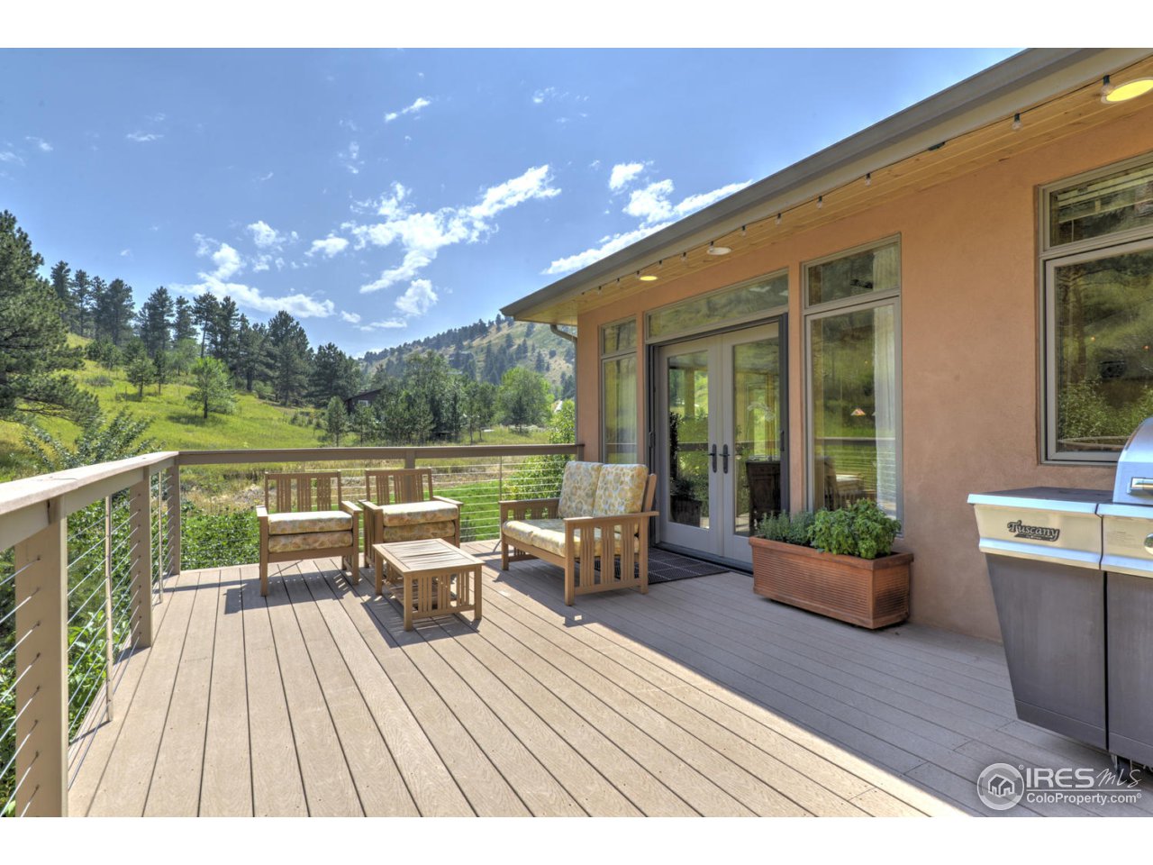 7010 Olde Stage Road Boulder, CO 80302 - Photo 18 of 31 a view of a balcony with couch and chairs