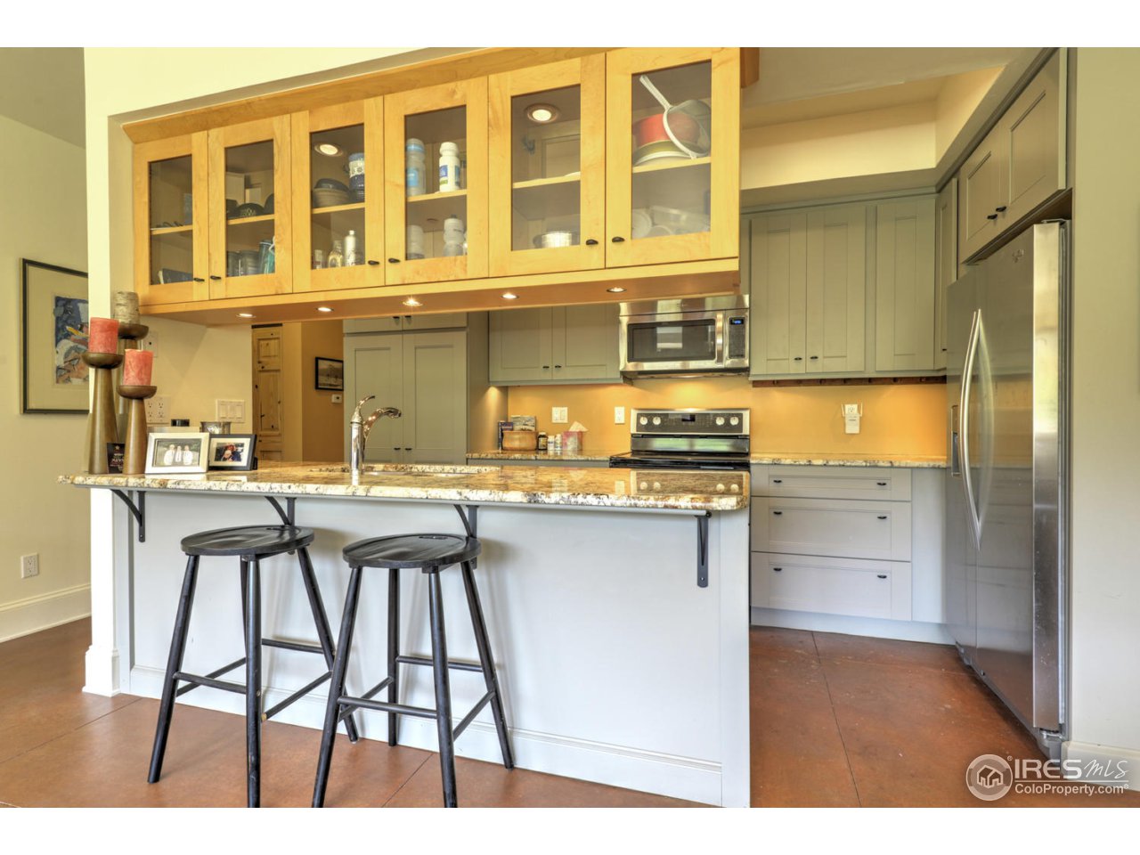 7010 Olde Stage Road Boulder, CO 80302 - Photo 22 of 31 a kitchen with a table chairs refrigerator and cabinets