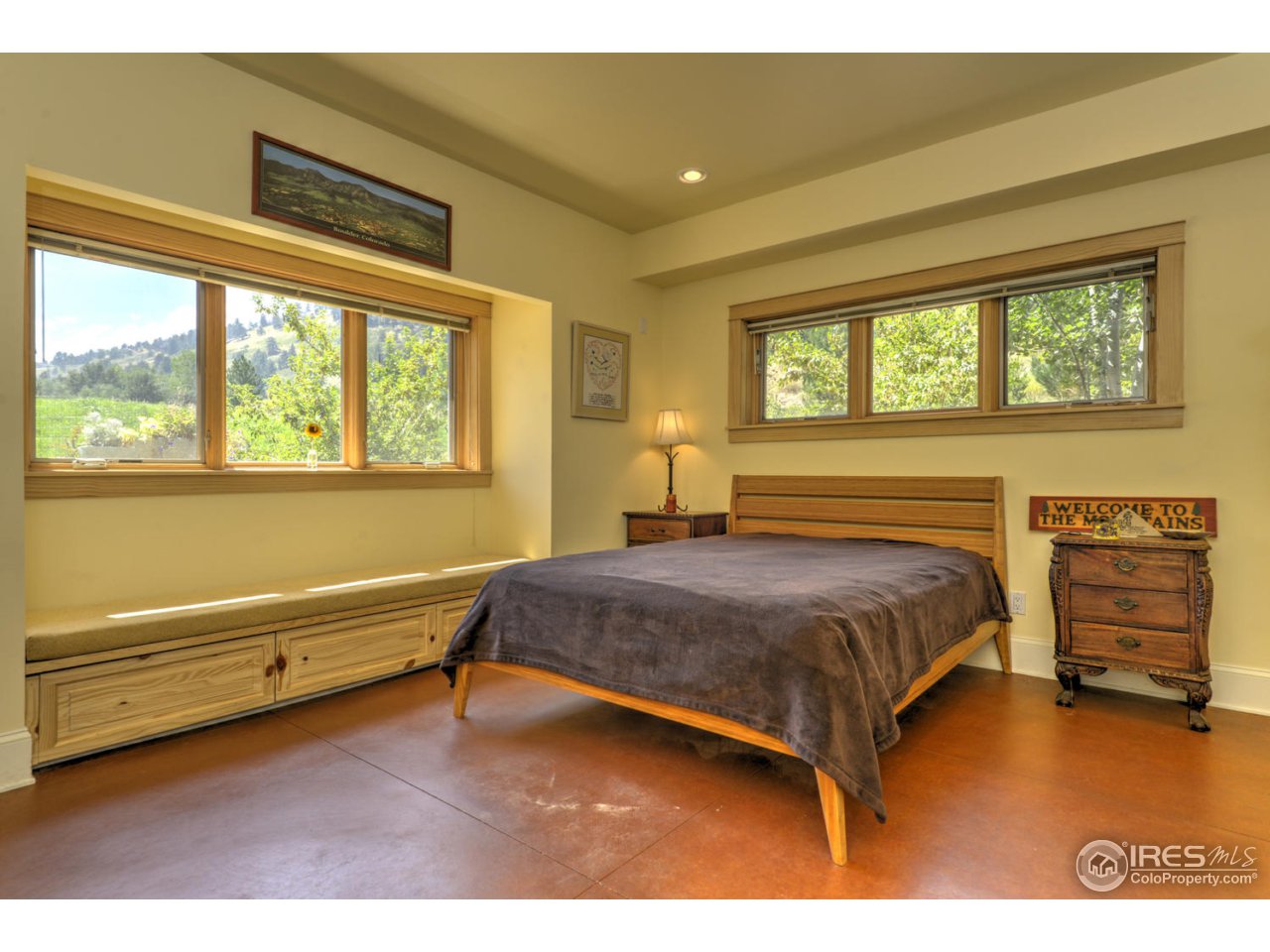 7010 Olde Stage Road Boulder, CO 80302 - Photo 23 of 31 a bedroom with a bed and wooden floor