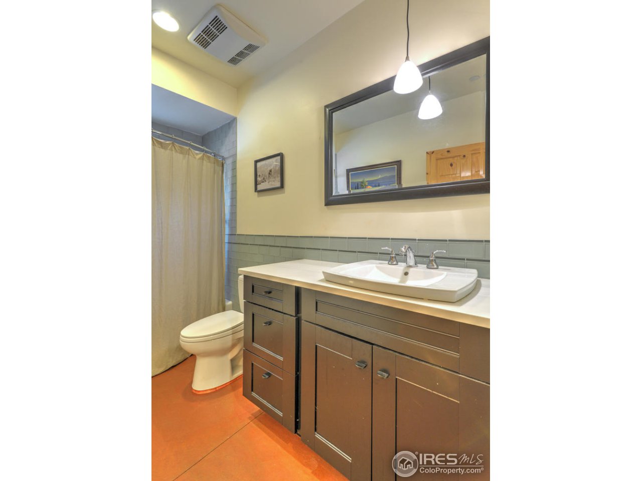 7010 Olde Stage Road Boulder, CO 80302 - Photo 24 of 31 a bathroom with a sink a toilet and a mirror