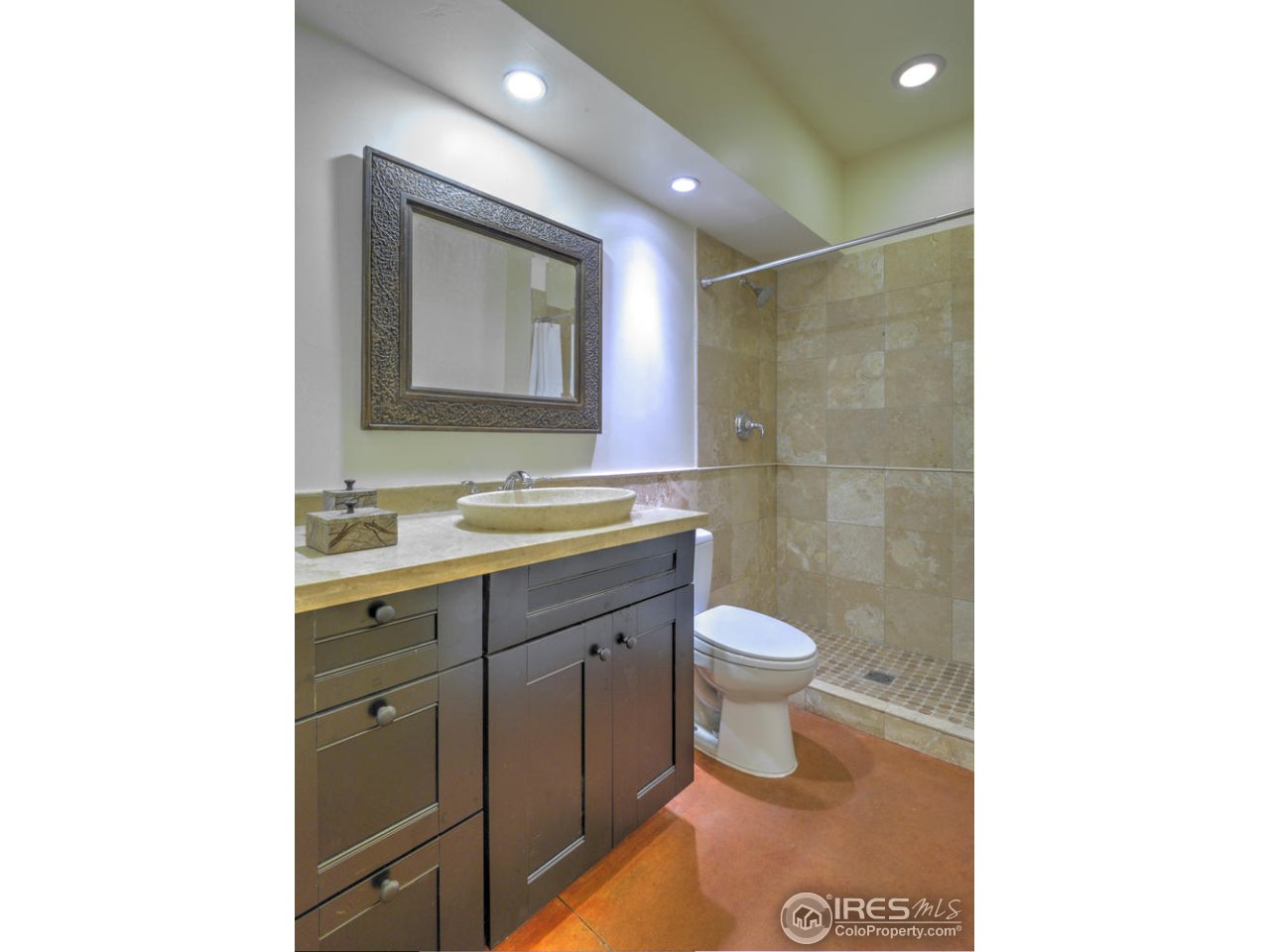 7010 Olde Stage Road Boulder, CO 80302 - Photo 26 of 31 a bathroom with a toilet sink and mirror