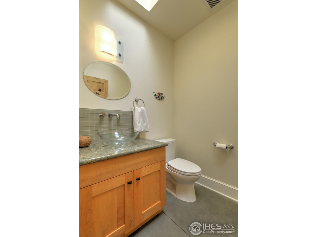 7010 Olde Stage Road Boulder, CO 80302 - Photo 30 of 31 a bathroom with a toilet sink and mirror