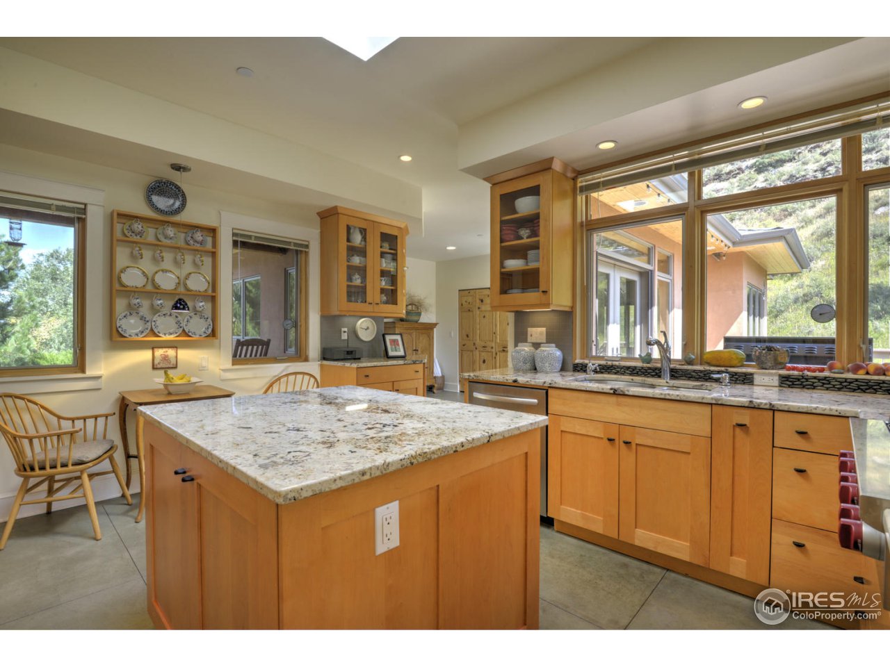 7010 Olde Stage Road Boulder, CO 80302 - Photo 9 of 31 a kitchen with a sink a counter top space and large windows