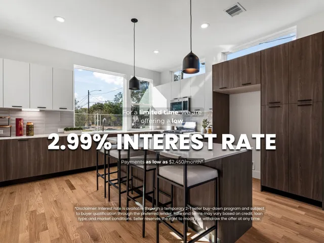 a kitchen with stainless steel appliances granite countertop a stove a refrigerator a sink a dining table and chairs with wooden floor