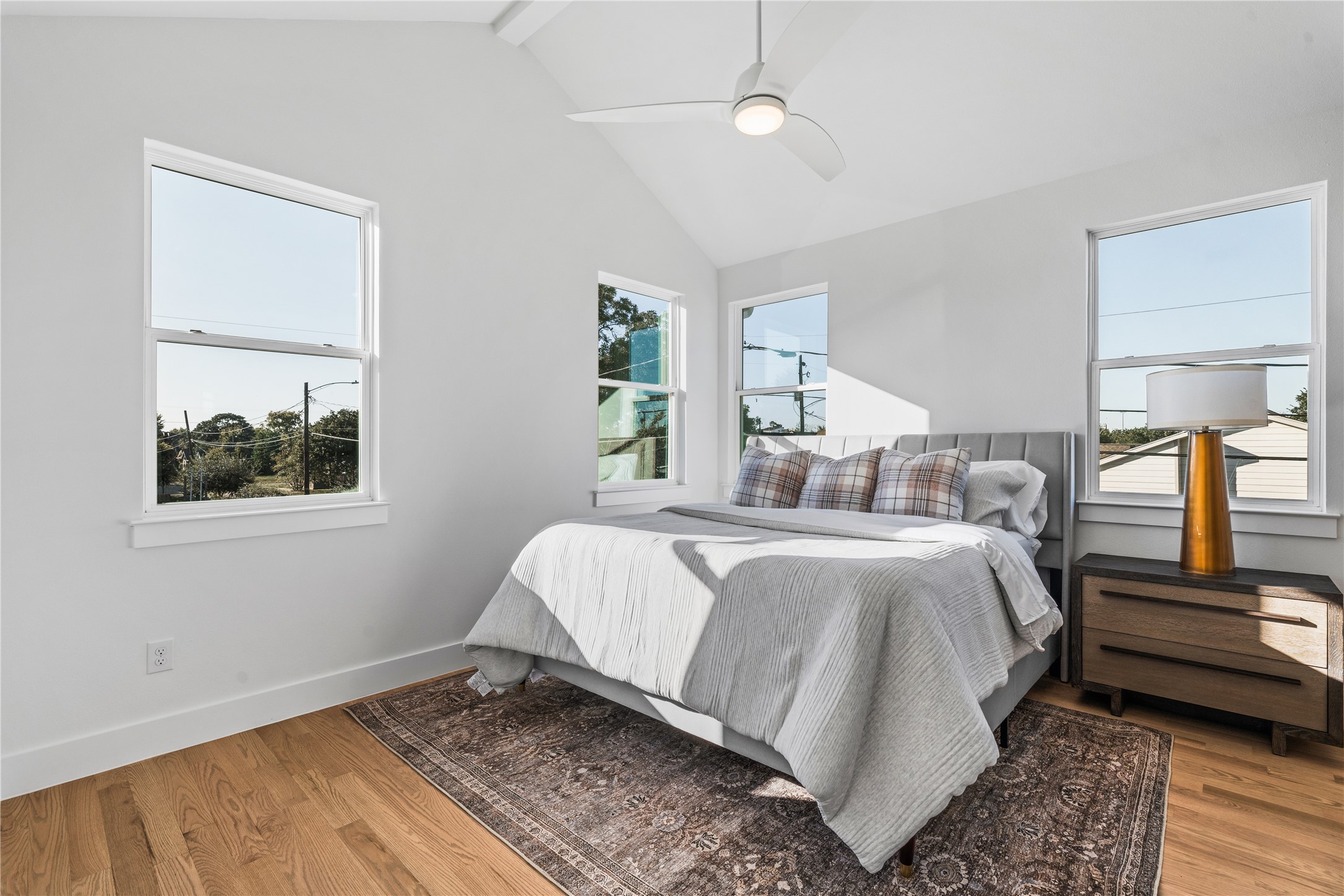 1810 Yates Street Houston, TX 77020 - Photo 17 of 30 Another view of the primary suite highlighting the vaulted ceilings, custom windows & modern ceiling fan that together create a bright, tranquil atmosphere.