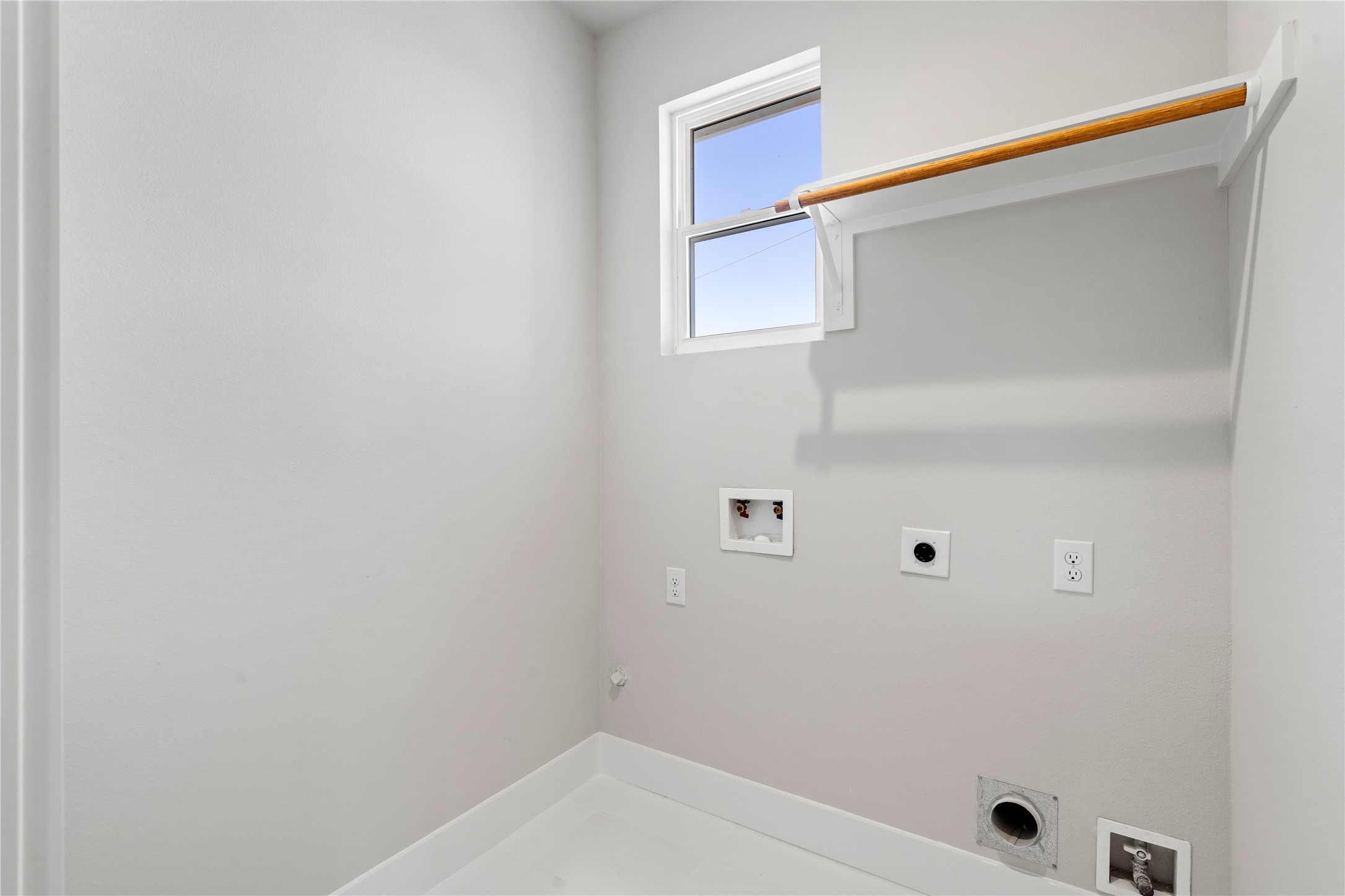 1810 Yates Street Houston, TX 77020 - Photo 26 of 30 Dedicated laundry room with utility connections and built in shelving for hanging the delicate garments.