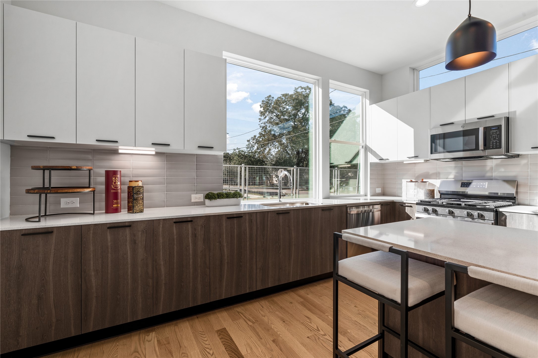1810 Yates Street Houston, TX 77020 - Photo 5 of 30 Bright & functional kitchen highlighted by under-cabinet lighting and a large picture window above the sink that floods the kitchen with natural light.