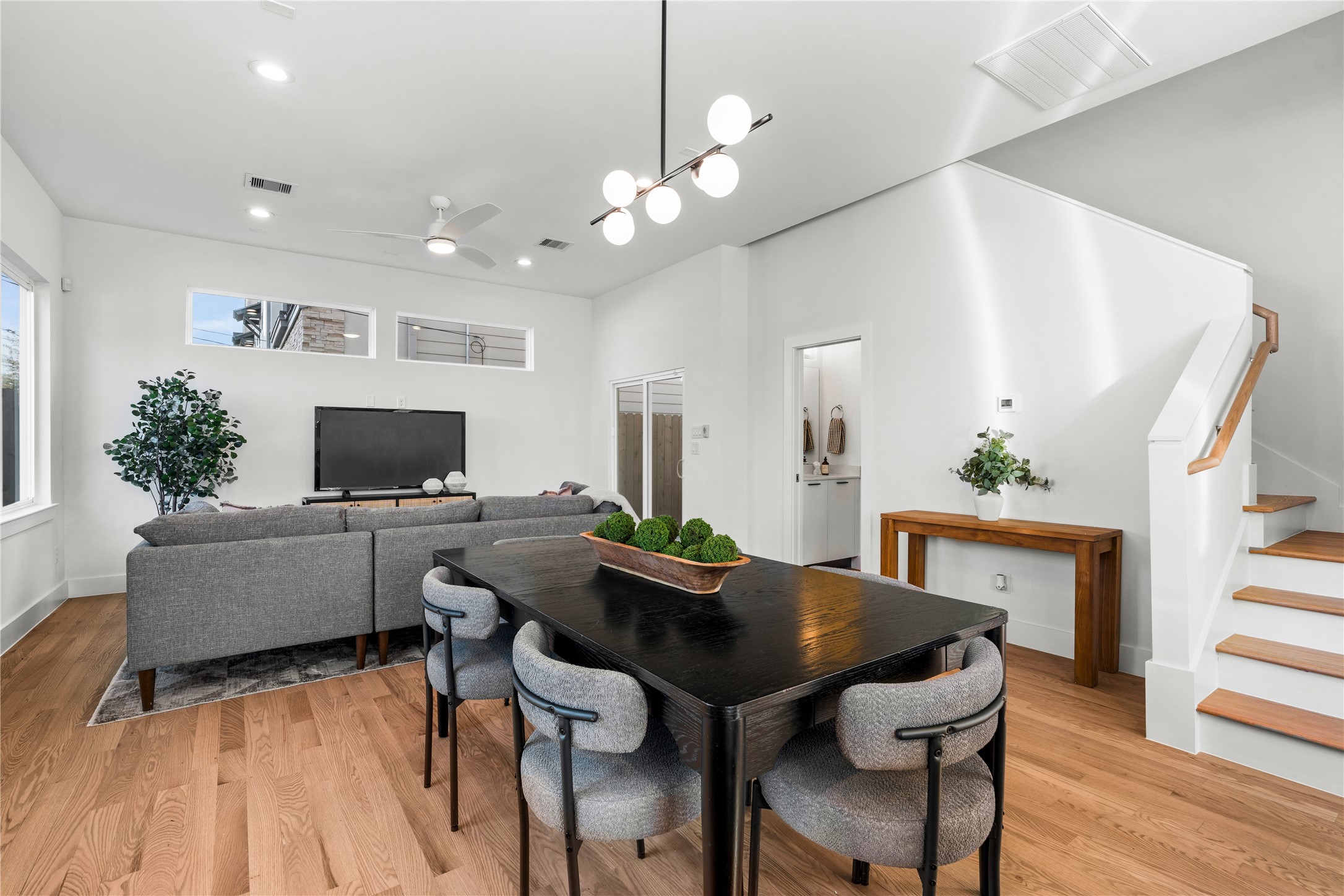 1810 Yates Street Houston, TX 77020 - Photo 9 of 30 Soaring 10-ft ceilings & designer lighting create an airy, elegant atmosphere as natural light highlights the craftsmanship & clean lines of the first floor.