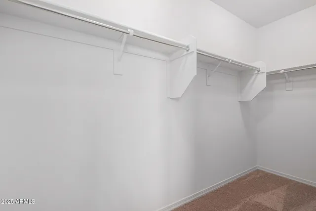 a view of a room with shelf on the wall