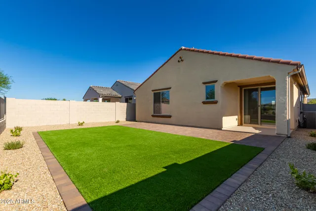 a view of a back yard of the house