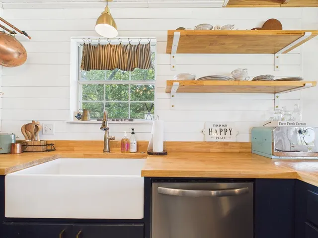 a bathroom with a sink a mirror and a window