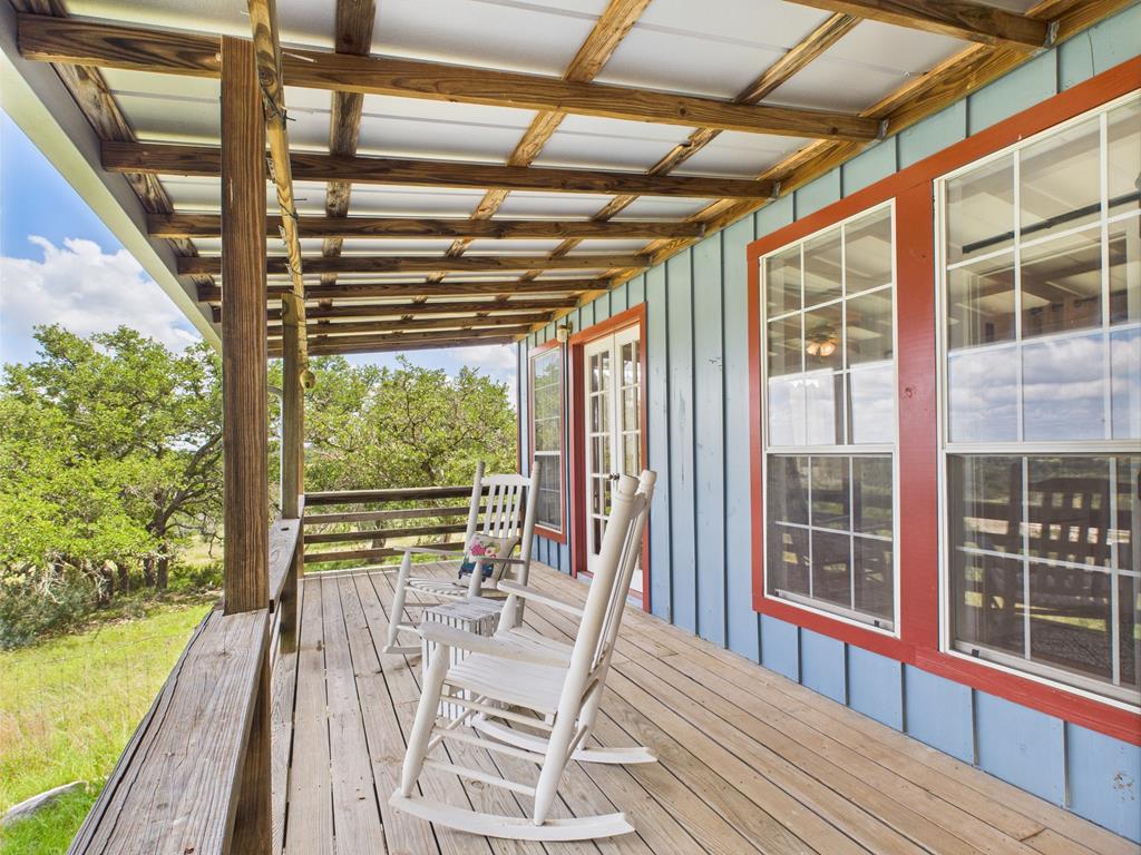 289 Kc 474 Harper, TX 78631 - Photo 13 of 27 a view of a patio with table and chairs and wooden floor