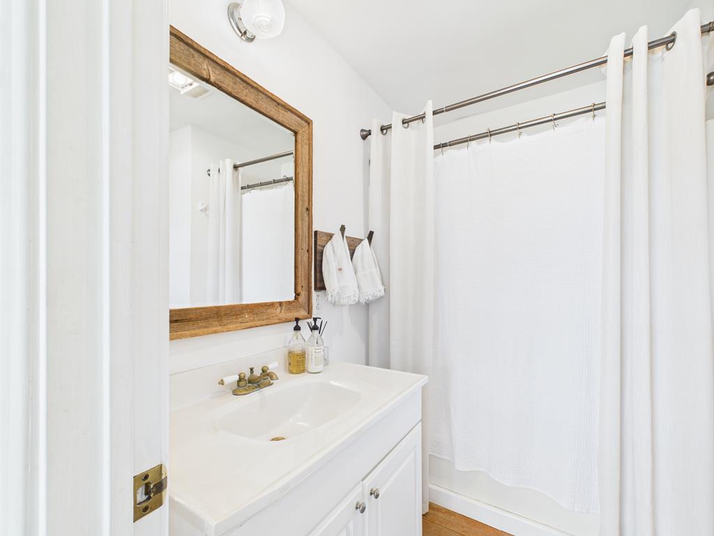 289 Kc 474 Harper, TX 78631 - Photo 16 of 27 a bathroom with a sink and a mirror