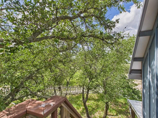 a view of a yard from a balcony