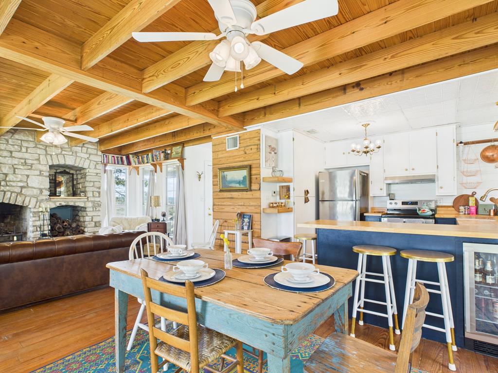 289 Kc 474 Harper, TX 78631 - Photo 8 of 27 a dining room with furniture and wooden floor