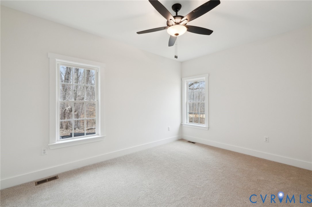 3520 Clintwood Road Midlothian, VA 23112 - Photo 25 of 32 an empty room with a window and a fan