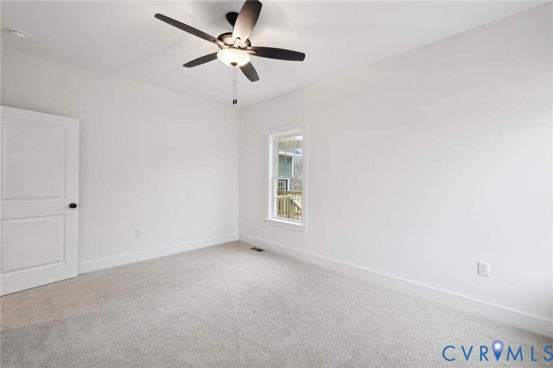 3520 Clintwood Road Midlothian, VA 23112 - Photo 29 of 32 an empty room with a window and a fan