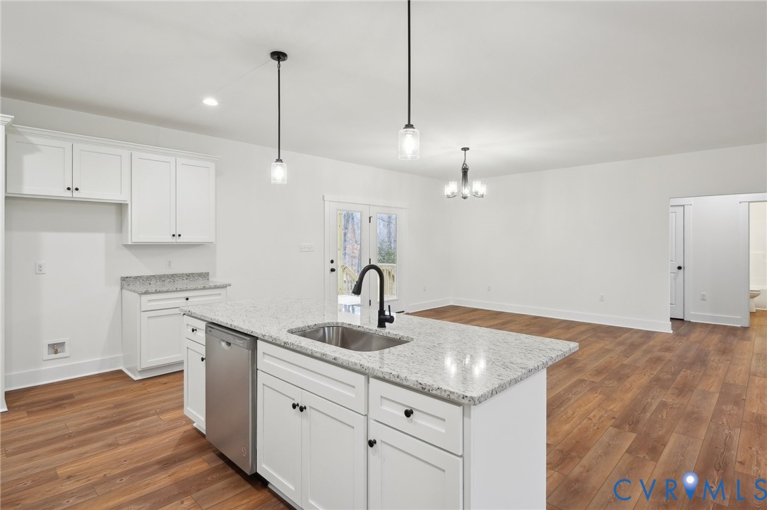3520 Clintwood Road Midlothian, VA 23112 - Photo 10 of 32 a kitchen with granite countertop a sink cabinets and wooden floor