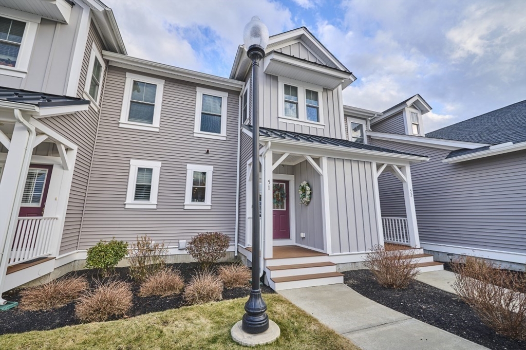 299 Lexington Street, Unit 51 Woburn, MA 01801 - Photo 19 of 37 a front view of a house with garden