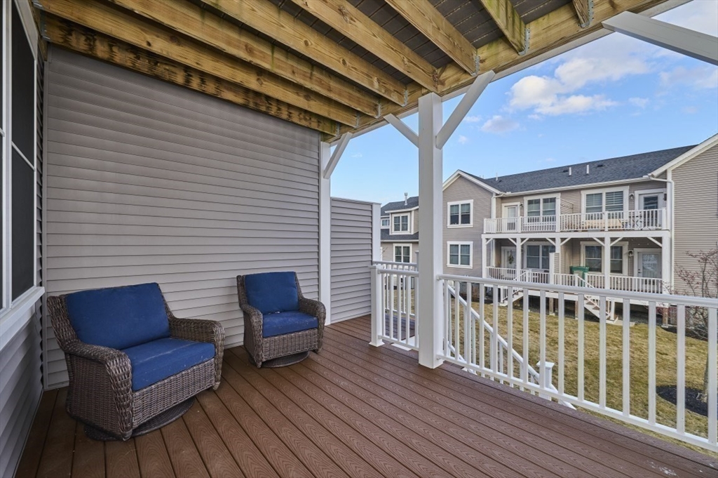 299 Lexington Street, Unit 51 Woburn, MA 01801 - Photo 21 of 37 a view of a chairs on the deck