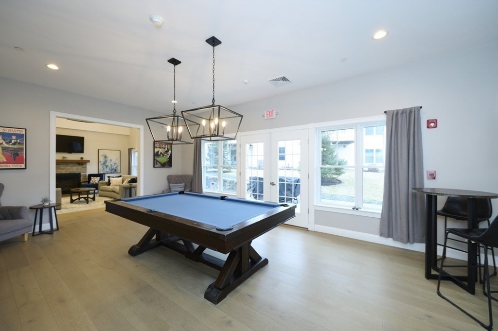 299 Lexington Street, Unit 51 Woburn, MA 01801 - Photo 28 of 37 a pool table sitting in the middle of a room