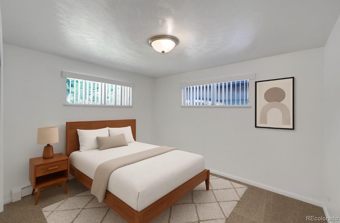 3709 Allison Street Wheat Ridge, CO 80033 - Photo 13 of 44 a bedroom with a bed and a window
