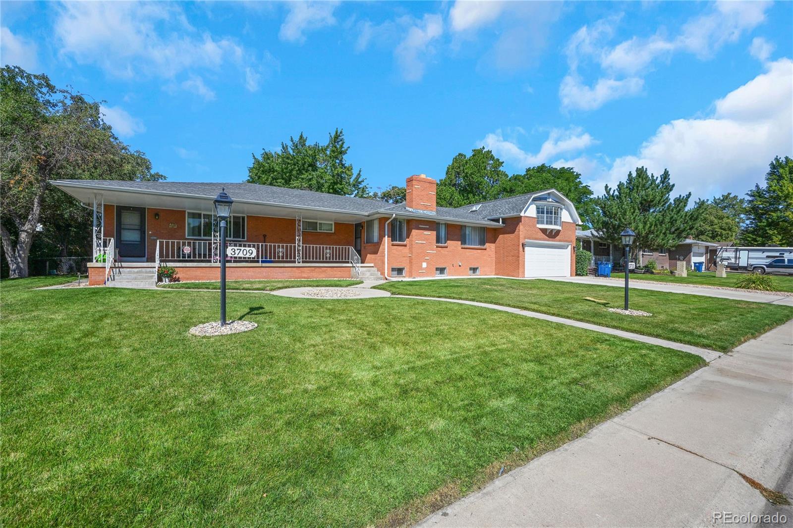 3709 Allison Street Wheat Ridge, CO 80033 - Photo 2 of 44 a view of a house with a yard