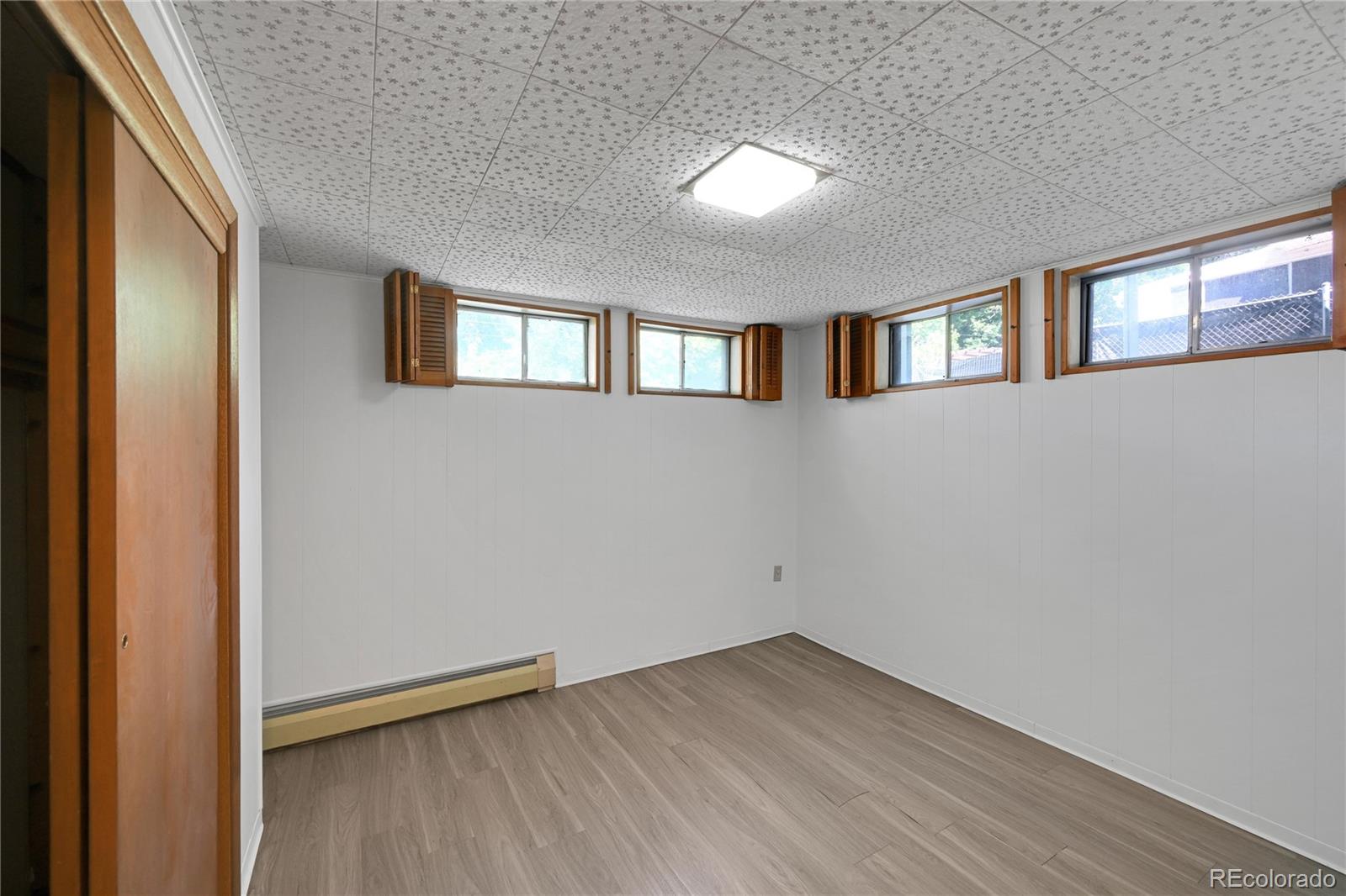 3709 Allison Street Wheat Ridge, CO 80033 - Photo 24 of 44 a view of an empty room with closet and a window