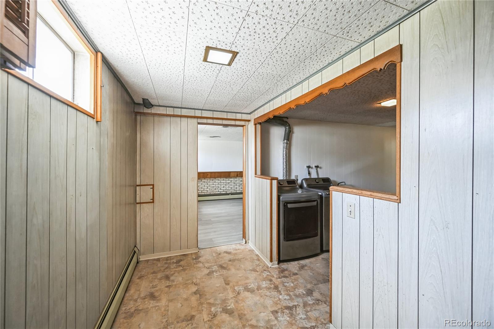 3709 Allison Street Wheat Ridge, CO 80033 - Photo 26 of 44 a view of a kitchen with a sink and refrigerator