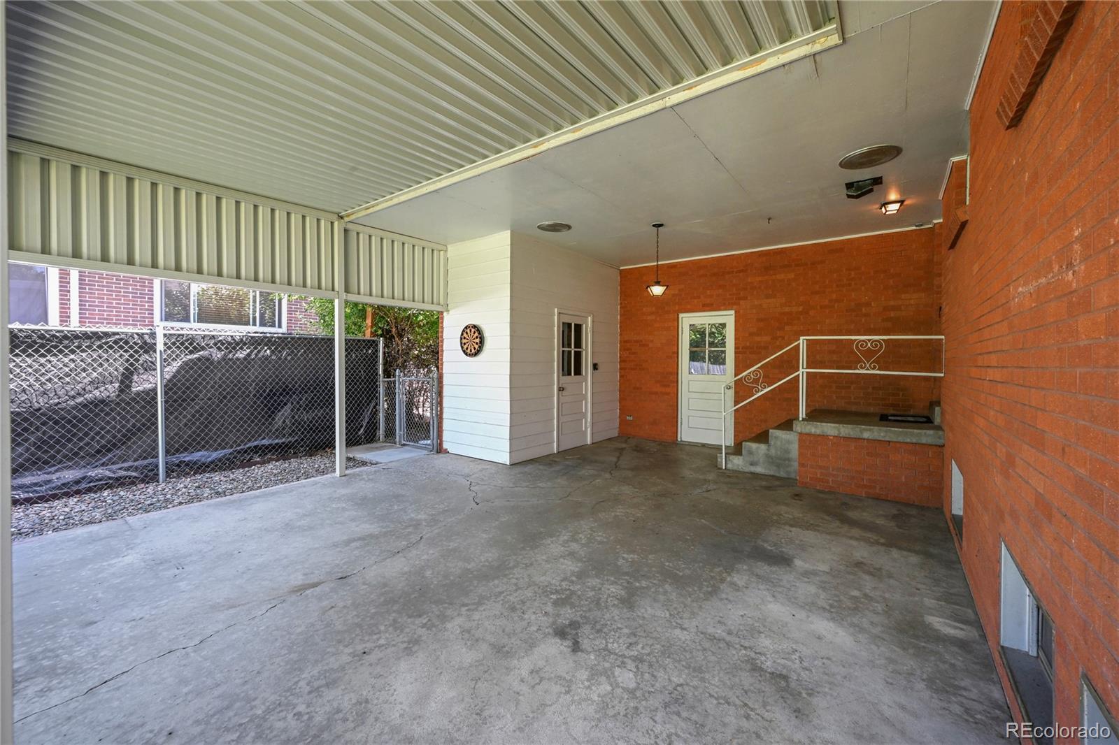 3709 Allison Street Wheat Ridge, CO 80033 - Photo 28 of 44 an empty room with furniture and garage