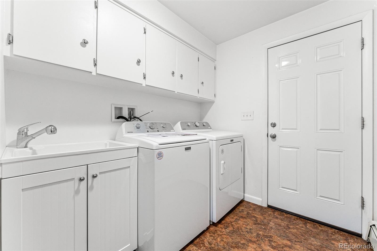 3709 Allison Street Wheat Ridge, CO 80033 - Photo 37 of 44 a utility room with cabinets washer and dryer