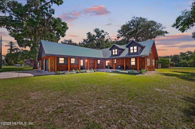 a view of a house with a yard