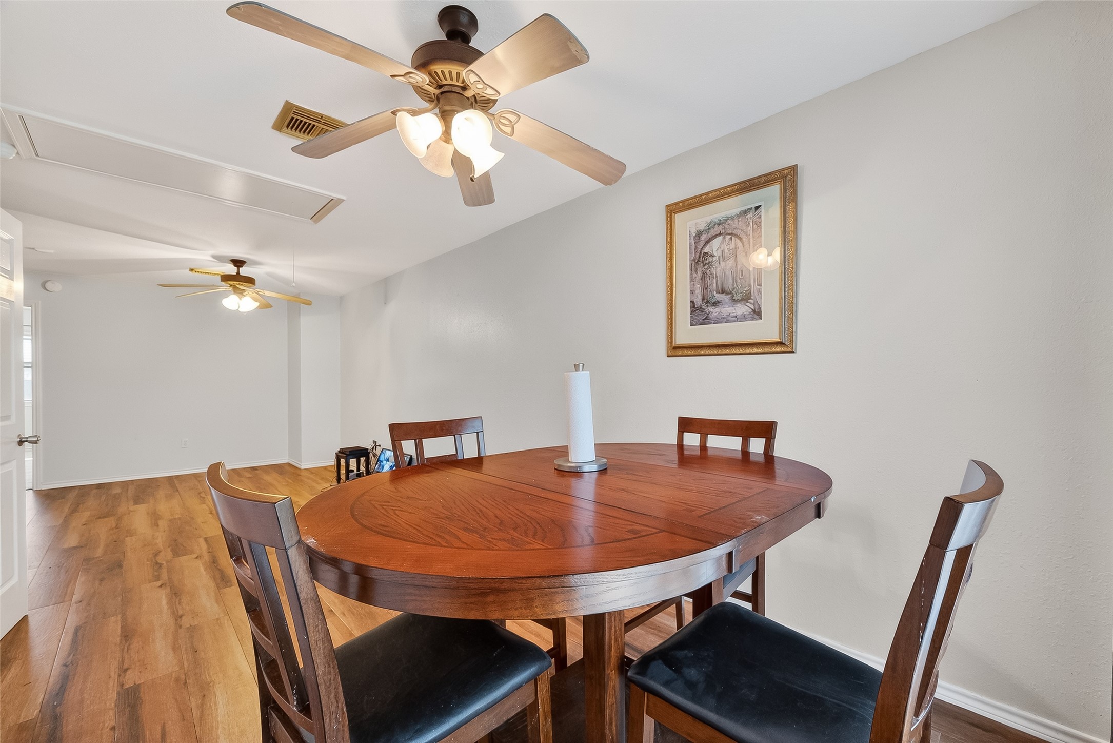 512 Bertloma Street Pasadena, TX 77502 - Photo 34 of 48 a view of a dining room with furniture and wooden floor