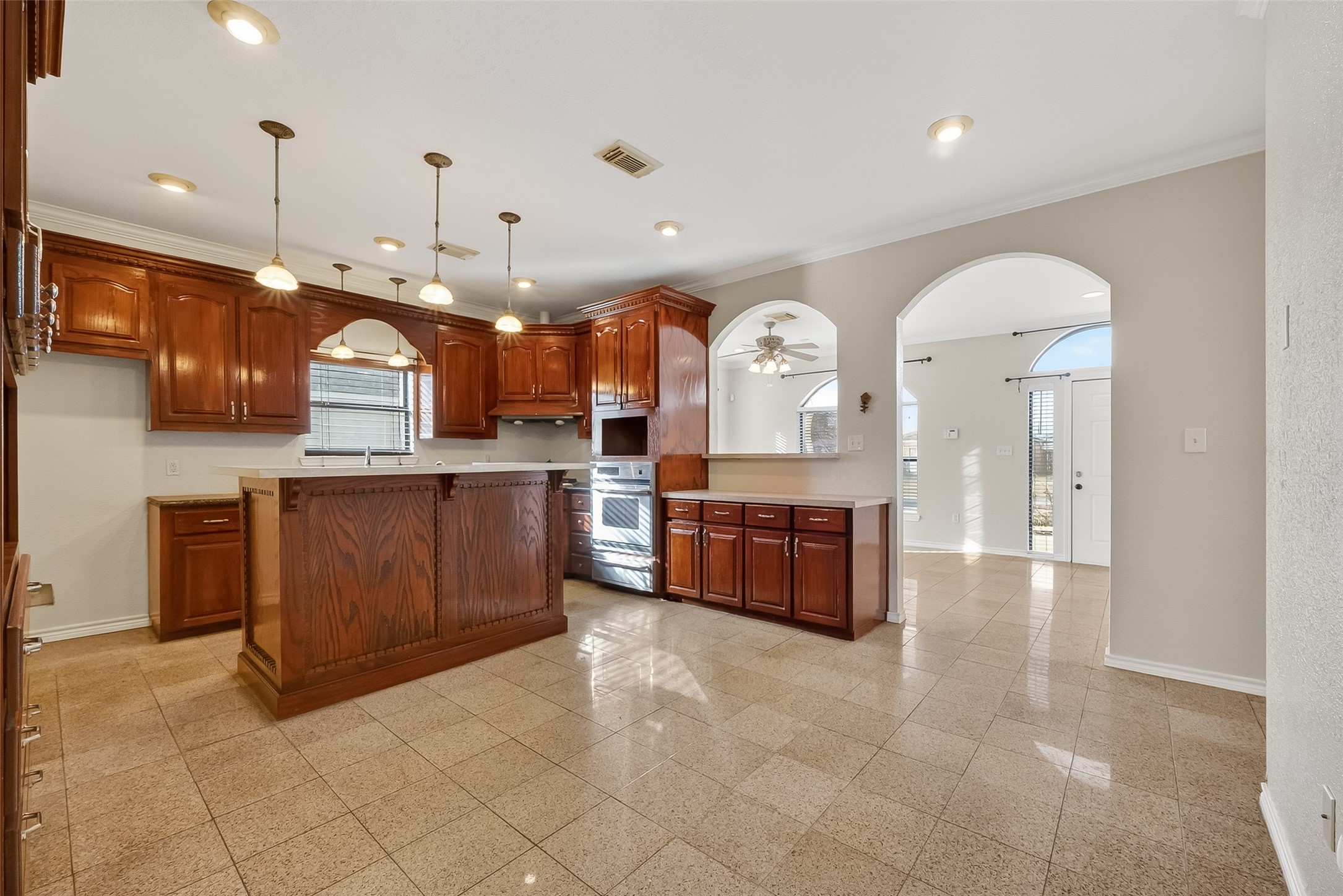 512 Bertloma Street Pasadena, TX 77502 - Photo 8 of 48 a large kitchen with a large counter top and stainless steel appliances