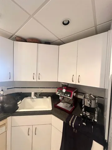 a bedroom with a bed and a ceiling fan