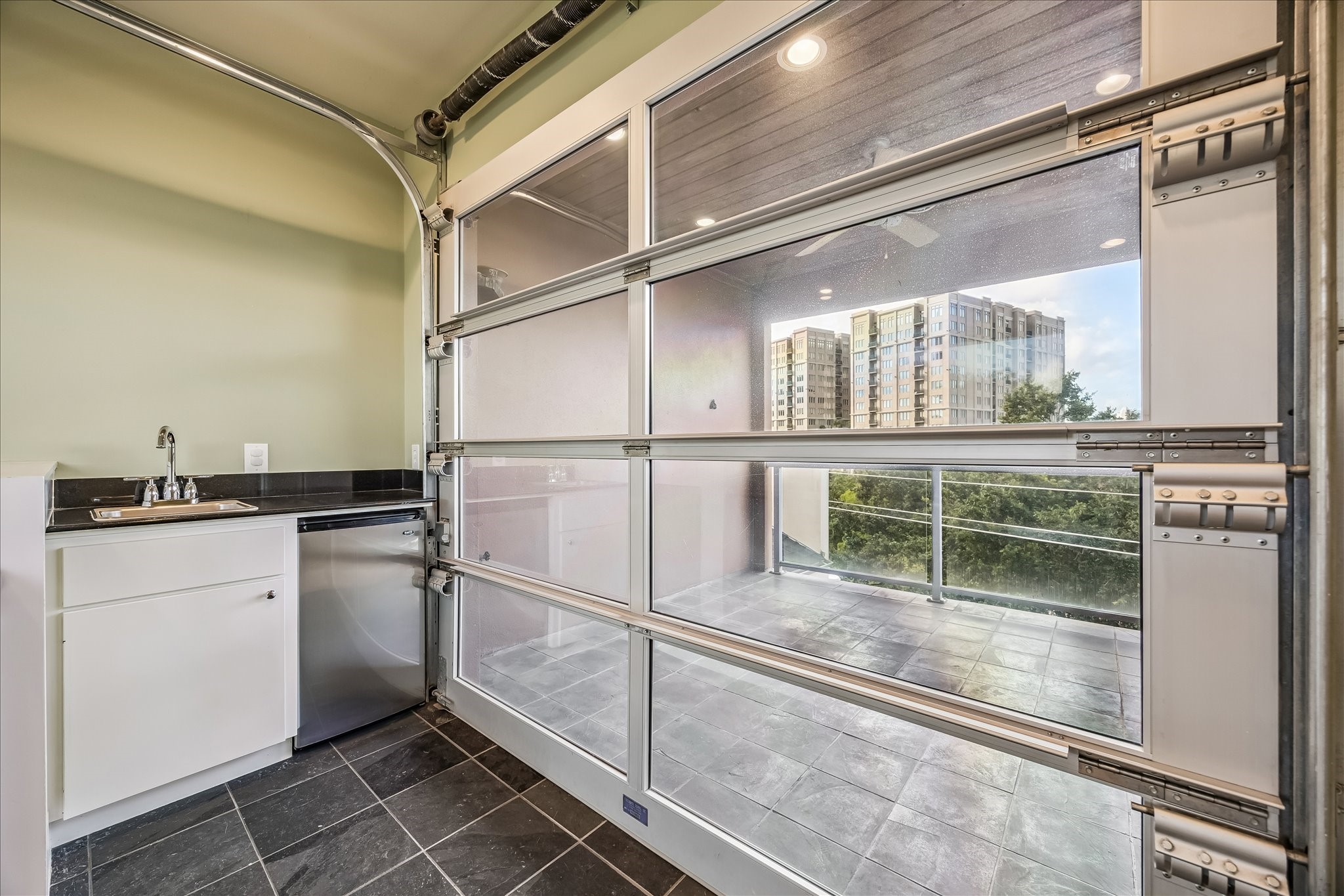1610 Calumet Street Houston, TX 77004 - Photo 24 of 36 a kitchen with a sink and refrigerator
