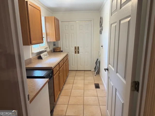 a spacious bedroom with a bed and furniture