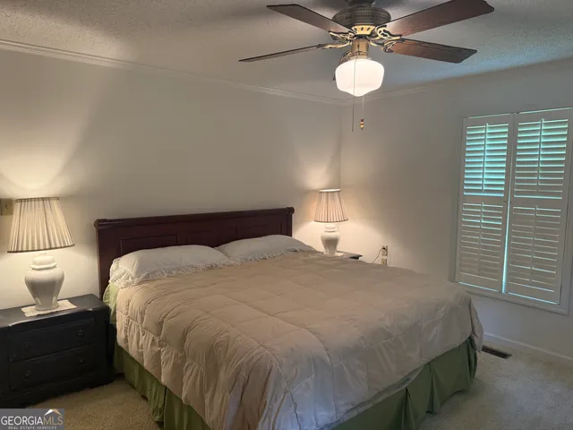 a view of a livingroom and kitchen with furniture