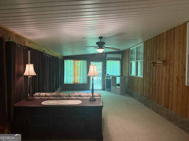 a bedroom with furniture and window