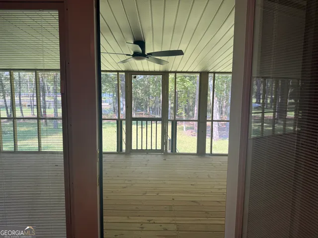 a view of balcony with wooden floor