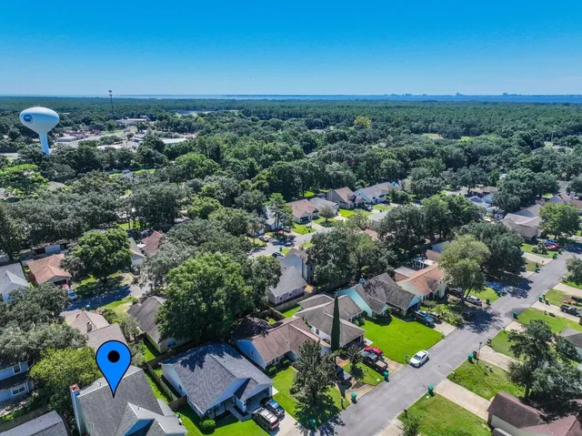 an aerial view of a house with a garden