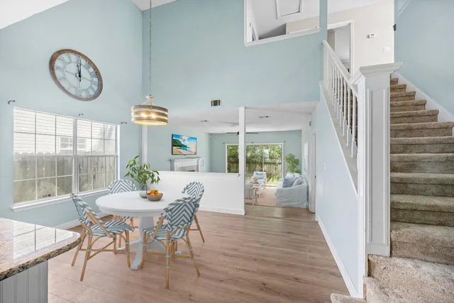 a view of a dining room with furniture window and wooden floor