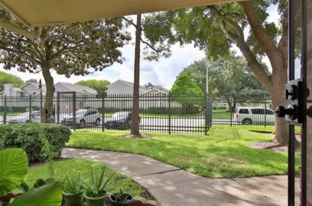 a view of a backyard with sitting area and slide